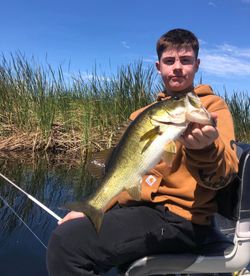A single fisherman enjoys a day of fishing in Fellsmere.
