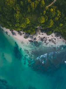 Aerial view of pristine turquoise waters and white sand beach with coral reef formations in Destin Florida