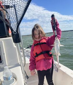 A person fishing in the scenic location of Whitney