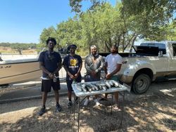 Group of four people fishing at Whitney location