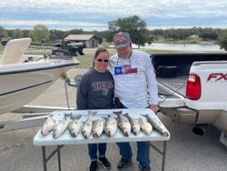 Two anglers fishing for striped bass in Whitney
