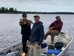 A group of 3 people fishing at Nestor Falls