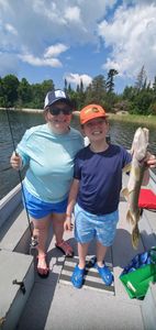 Anglers catching a big fish in Ontario