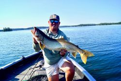 Lake trout fishing success in Nestor Falls ON with large catch displayed on boat