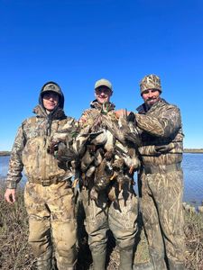 Four people fishing and hunting in Matagorda
