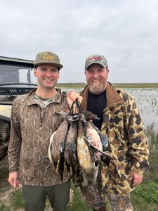 Successful duck hunting trip in Matagorda TX with multiple waterfowl harvested near marsh