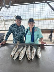 Five fish caught by two people in Matagorda