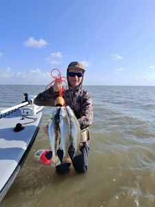 Successful speckled trout fishing catch in Matagorda TX with multiple fish displayed on boat