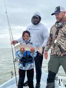 3 people fishing in Aransas Pass