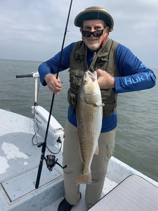 Angler with a 23-inch redfish caught in TX