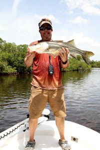 A single angler fishing in an unknown location