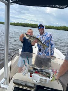 A snook fish caught by two people fishing in Bonita Springs