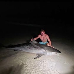 A lone angler fishing in the waters of Destin