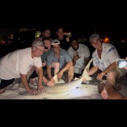 Group of 7 people enjoying fishing trip in Destin