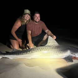 Two anglers with a big 52-inch fish catch in Destin