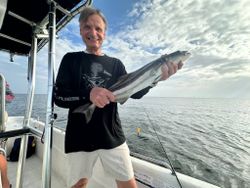 Happy — sleek Cobia catch!