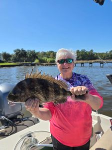 Grinning — hefty Sheepshead catch!