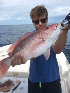 An angler with a single 19-inch fish in D'Iberville