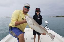 Two anglers with a big 21-inch fish in Mississippi