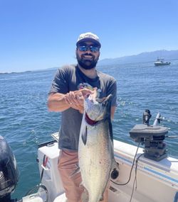 A lone fisherman casting their line into the waters of Sooke