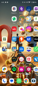 Mobile phone screen displaying various apps with large magnet graphic overlay
