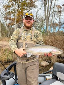 Angler holding a pink salmon in Newaygo County