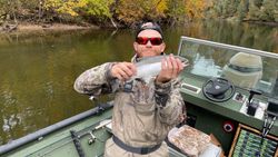 Angler with a rainbow trout in Newaygo County