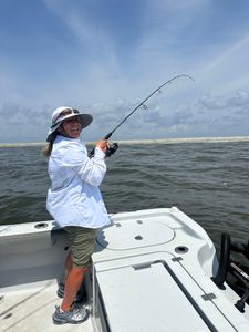 Person enjoying a cruise, fishing, or tour in Mississippi