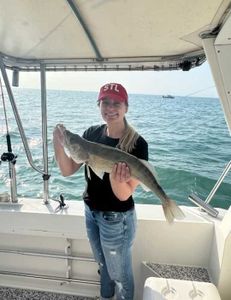 Angler with a large, 22-inch fish in Marblehead