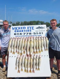 Angler holding 9 fishing rods in Marblehead