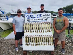 Four people enjoying a fishing trip in OH
