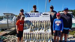6 people enjoying a fishing trip in Marblehead