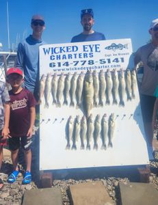 Three people fishing in Ohio with three fish