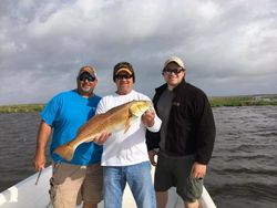 Three people fishing in Saint Bernard