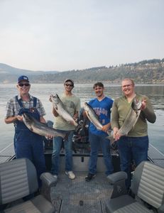 Father and sons with their fish