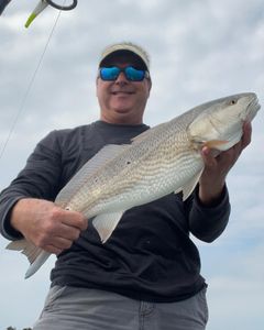 Angler fishing in the waters of Cape Carteret
