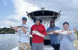 Four people fishing at Cape Carteret