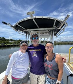 Three people fishing at Cape Carteret
