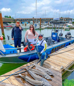 Three people enjoying a fishing trip in Oregon