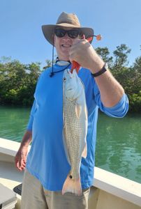 A lone fisherman reeling in a great catch in FL