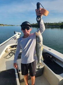 A person fishing for a snook in Florida