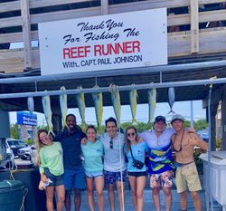 Successful mahi mahi fishing trip in Islamorada FL with multiple fish displayed at dock