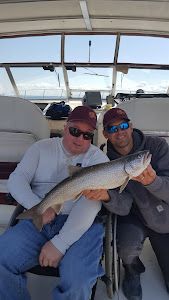 2 people fishing on the shore of Knife River