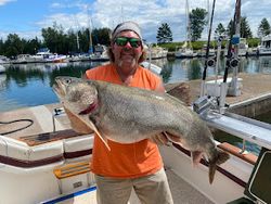 Angler fishing with rod and reel in Knife River