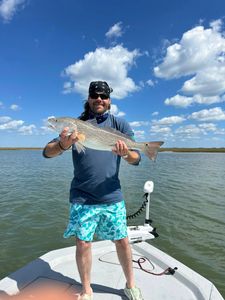 Angler fishing on the shores of TX