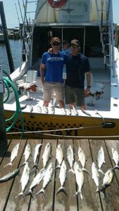 One fisherman reeling in a big catch at Wanchese Marina Llc