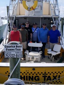 Group of 6 people at Wanchese Marina Llc on a fishing trip