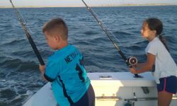 Two anglers fishing at Wanchese Marina Llc