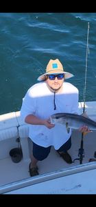 Angler with fishing rod enjoying the scenery in Gulf Shores