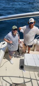 Two people fishing at Gulf Shores